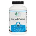 A white plastic bottle of Ortho Molecular Products Reacted Calcium dietary supplement with a black cap and blue label accents, shown on a white background.